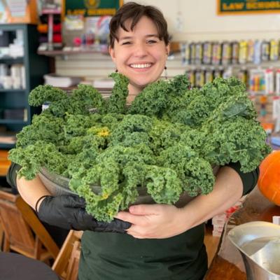 Lauren Wustenberg holding a big bowl of kale