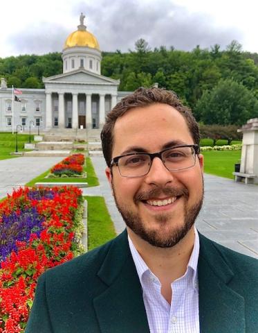 Photograph of a Law Student in front of the Vermont State Capitol building