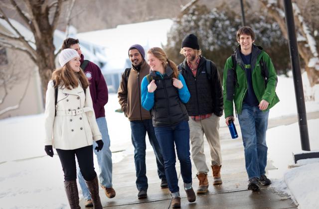 students walk to campus on a snowy day