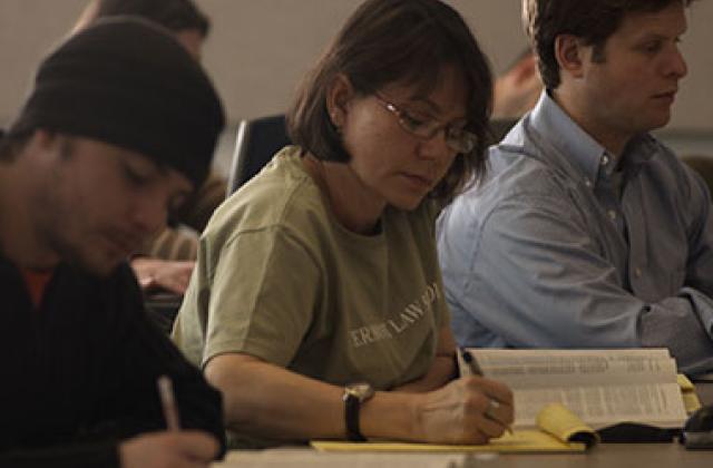 students take notes in Dean Mihaly's Energy Regulation class