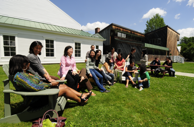 A group of U.S.-Asia Partnership fellows sitting outside on a sunny day on the grass at VLS campus.
