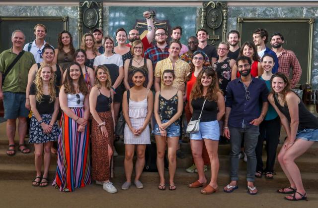 A group of VLS students poses for a group shot on the steps of the University of Havana, Cuba
