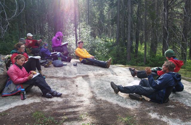Jack Tuholske and students in an outdoor classroom backpacking in Montana