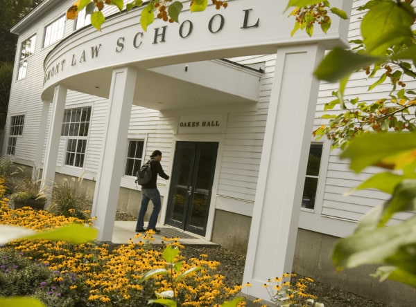 Student walking into the front entrance of the school.