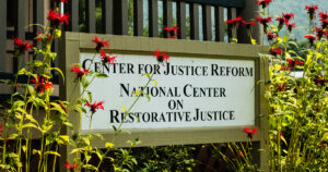 Center for Justice Reform and National Center for Restorative Justice sign on the VLGS campus.