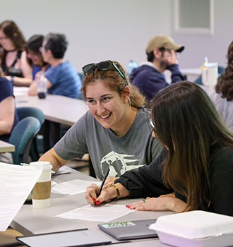 Students discuss next steps during a disaster simulation.