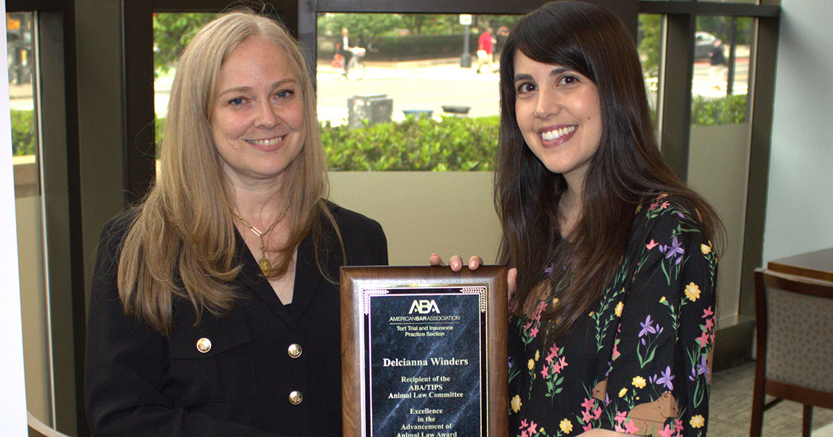 Delcianna Winders accepts the American Bar Association Tort Trial and Insurance Practice Section's (TIPS) Excellence in Advancement of Animal Law Award