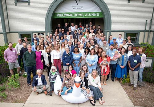 Alumni pose in front of Debevoise Hall during Alumni Weekend 2025